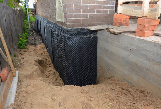 SJ Waterproofing Pros technician performing targeted Exterior Waterproofing assessment in Putnamville, IN